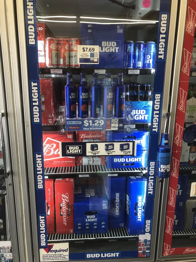 Our coolers stay stocked with Bud Light and Budweiser in every size, from six-packs to 24-packs, all at everyday low prices. It's a quick, cold grab whether you're picking up a single six-pack or stocking up for the weekend. Bud Light and Budweiser multipack display inside the beer cooler at GS Vape Beer & Tobacco in Barberton, Ohio.