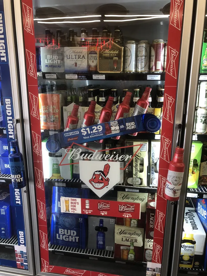 This section of the cooler rotates through Yuengling, Michelob Ultra, and Budweiser favorites alongside seasonal picks like Corona. There's a mix of price points and pack sizes so you can find exactly what fits your night. Budweiser, Yuengling, and Michelob Ultra beer selection in the cooler at GS Vape Beer & Tobacco in Barberton, Ohio.