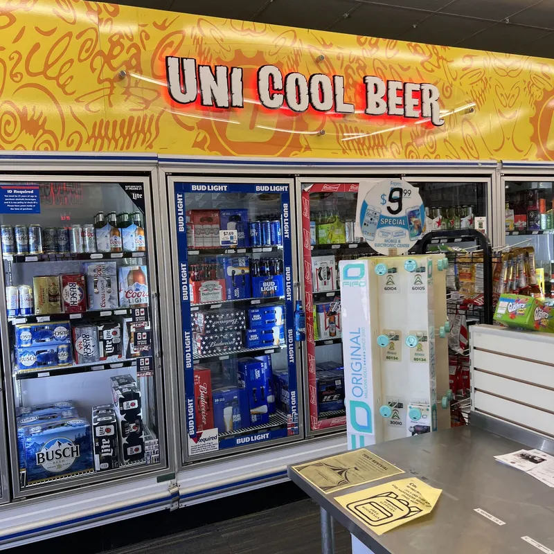 Glass-door beer cooler wall at GS Vape Barberton, stocked with a wide selection of domestic and craft beer. Uni Cool Beer cooler wall stocked with craft beer at GS Vape Barberton