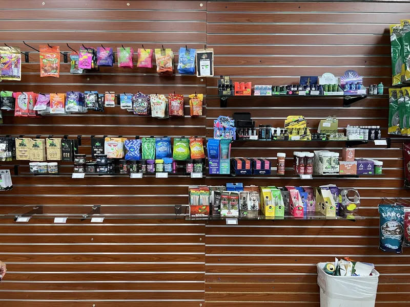 Wall display of Delta-8, THC-O, and kratom extract products with pricing tags at GS Vape in Barberton, Ohio