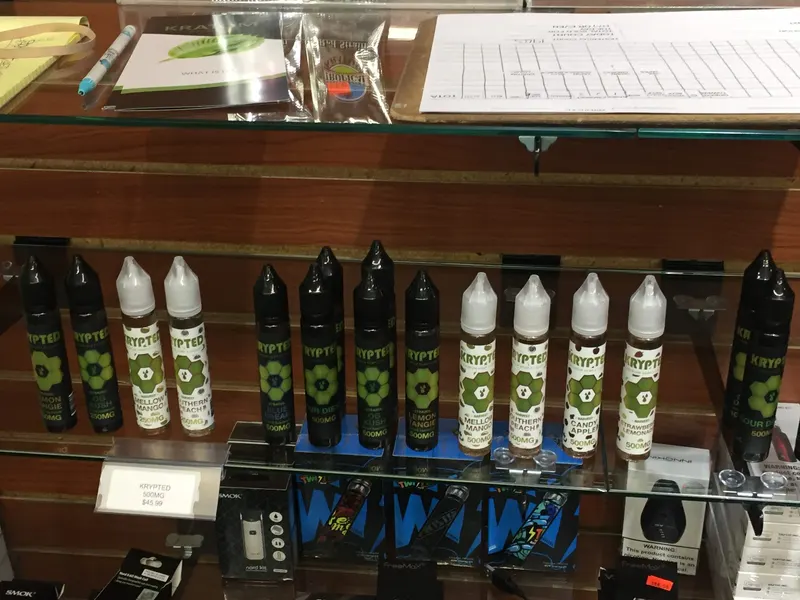 Krypted brand hemp e-liquid bottles in flavors like Blue Dream and Lemon Tangie at GS Vape Beer & Tobacco in Barberton, Ohio.