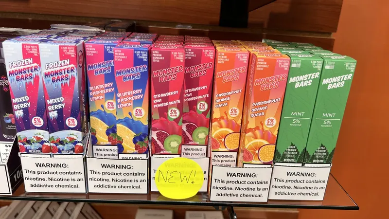 Row of Monster Bars disposable vape flavors on a shelf at GS Vape in Barberton, Ohio