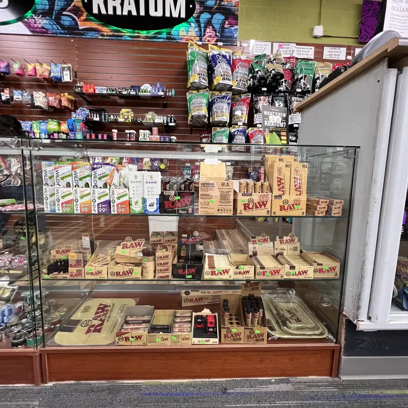 We carry the full RAW lineup, from classic papers and cones to rolling trays and tips, all organized in one easy-to-browse case. It's a favorite stop for shoppers who like to roll their own. RAW rolling papers, cones, and rolling trays displayed in a glass case at GS Vape in Barberton, Ohio