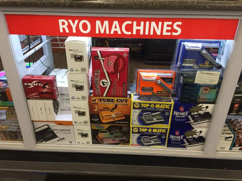 Roll-your-own cigarette machines and rolling supplies on display at GS Vape Barberton, Ohio. RYO Machines and rolling supplies shelf at GS Vape Barberton