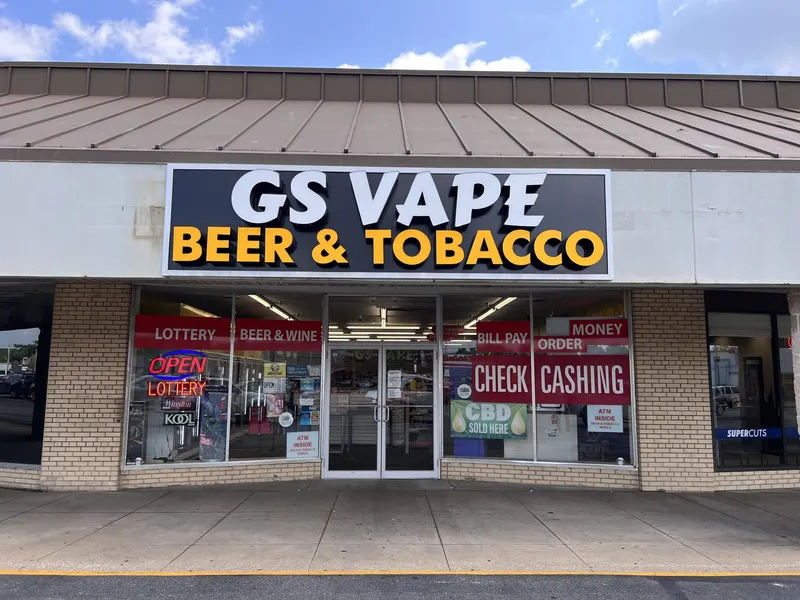 Our storefront says it all right up front: vape gear, beer and wine, lottery tickets, and check cashing all under one roof. Whether you need a pack of Zyn or a money order, this is a one-stop shop for the neighborhood. GS Vape Beer & Tobacco storefront entrance in Barberton, Ohio showing lottery, check cashing, and bill pay signage