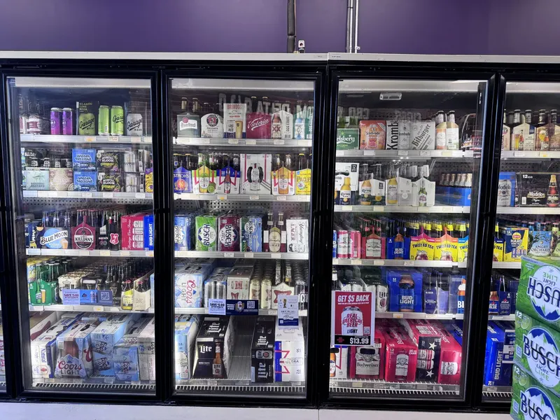 GS Vape Madison's glass-door beer cooler holds a wide selection of craft and domestic beers organized for quick browsing. Price signage helps customers spot deals as they shop. Craft beer cooler with glass doors and wide selection at GS Vape in Madison, Ohio
