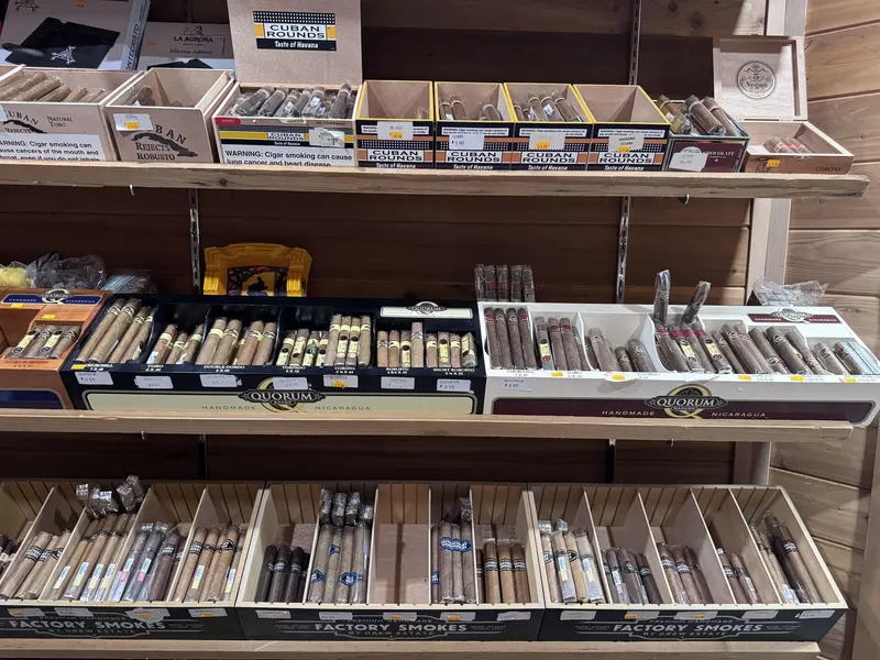 Cuban Rounds and Quorum handmade cigars are among the featured brands in GS Vape Madison's humidor room. Each box is priced and organized for easy comparison shopping. Cuban Rounds and Quorum cigar display inside the humidor room at GS Vape in Madison, Ohio
