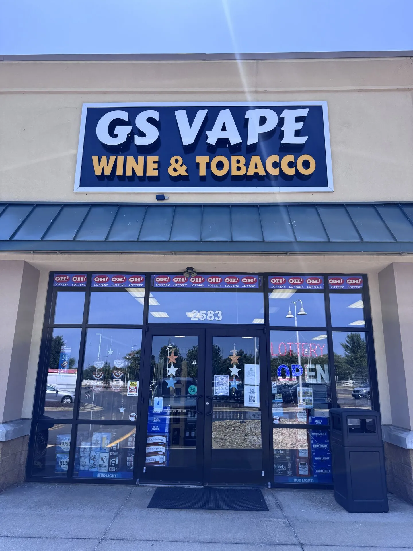 GS Vape Wine & Tobacco storefront exterior with illuminated sign in Madison, Ohio