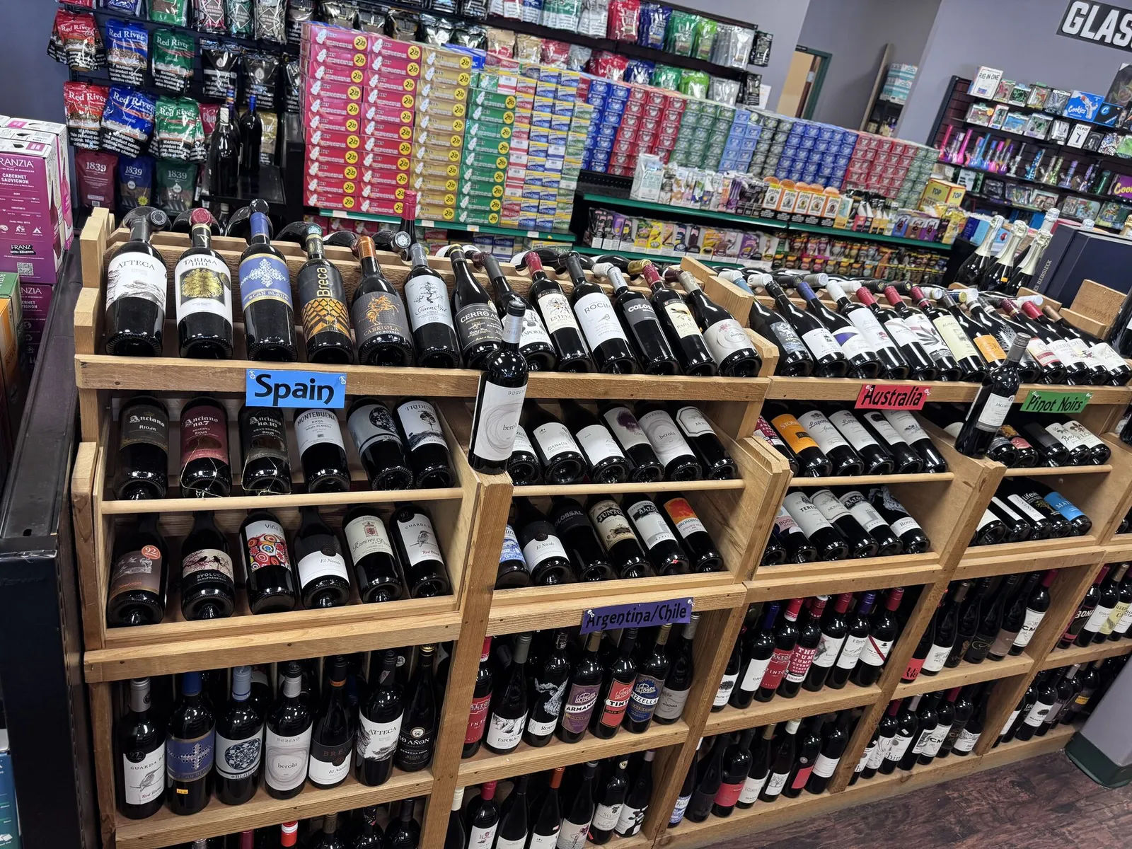 International wine selection organized by country including Spain and Australia at GS Vape in Madison, Ohio